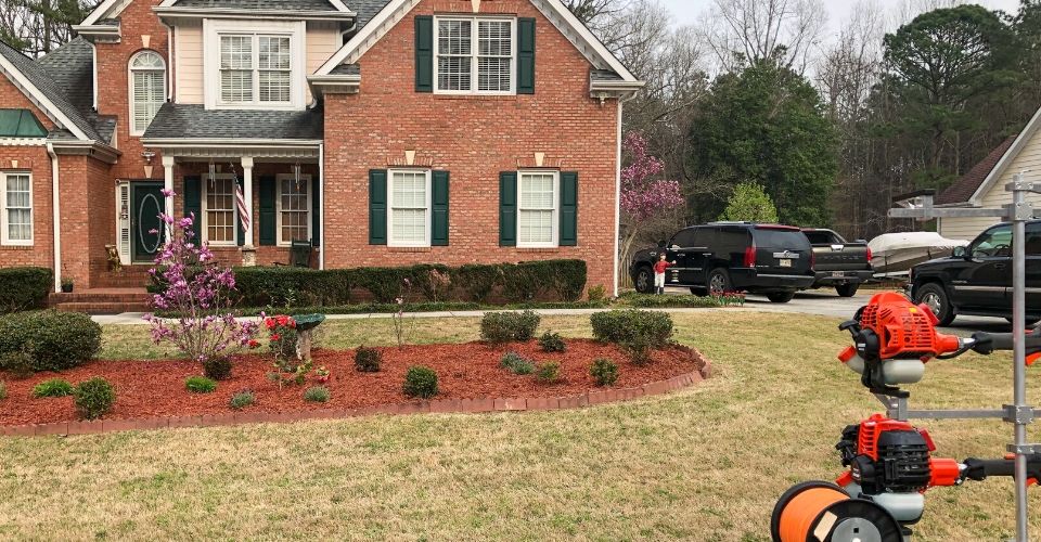 Gwinnett Lawns Lawn Care A Gwinnett Lawns Lawn Care client's home in Gwinnett County, GA with lawn equipment.